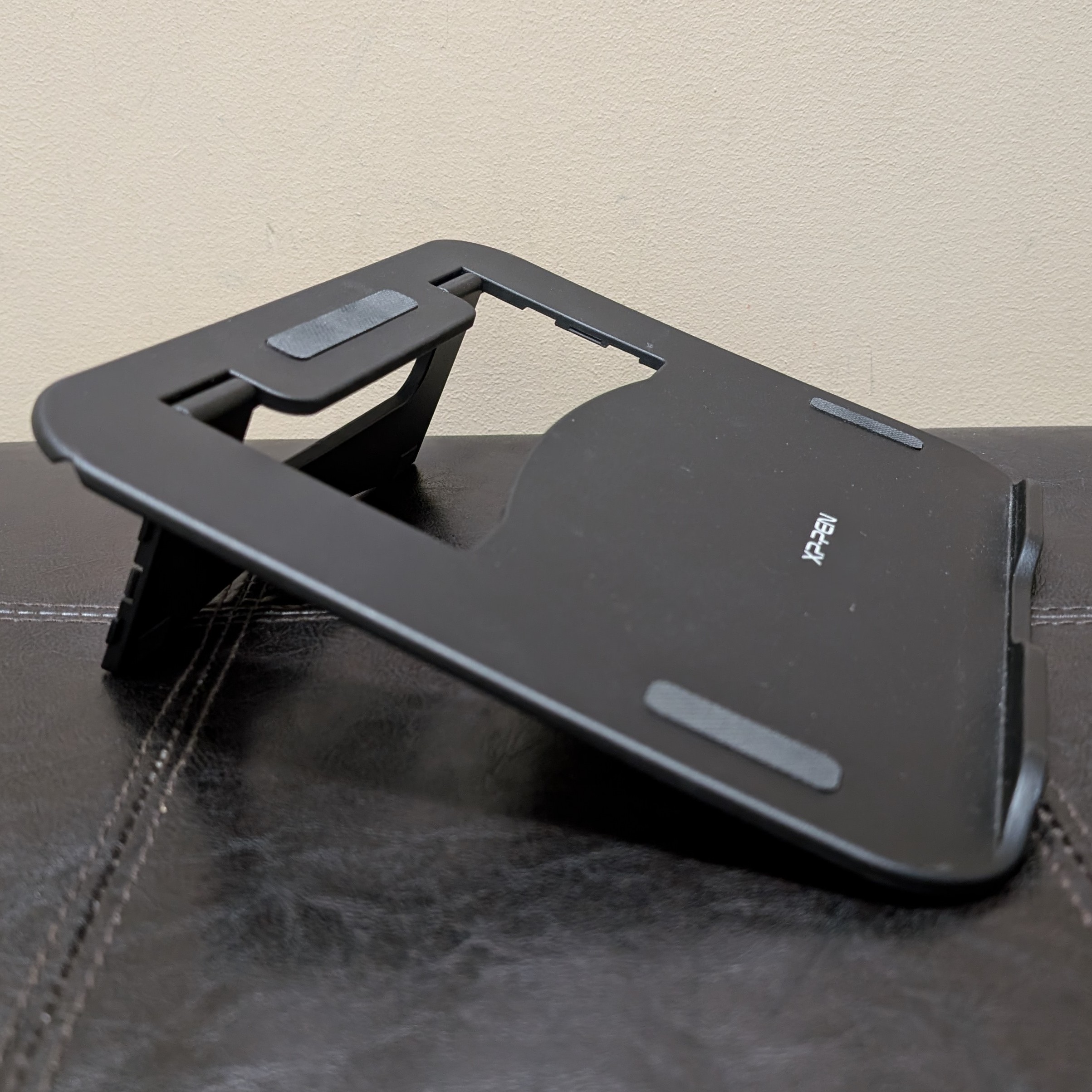 Tablet stand. <br>
                I chose to revise my model for this object because I wanted to try
                3D printing with booleans (used to make the gap) and extrusions (used to make the
                resting spot of the tablet) in place.