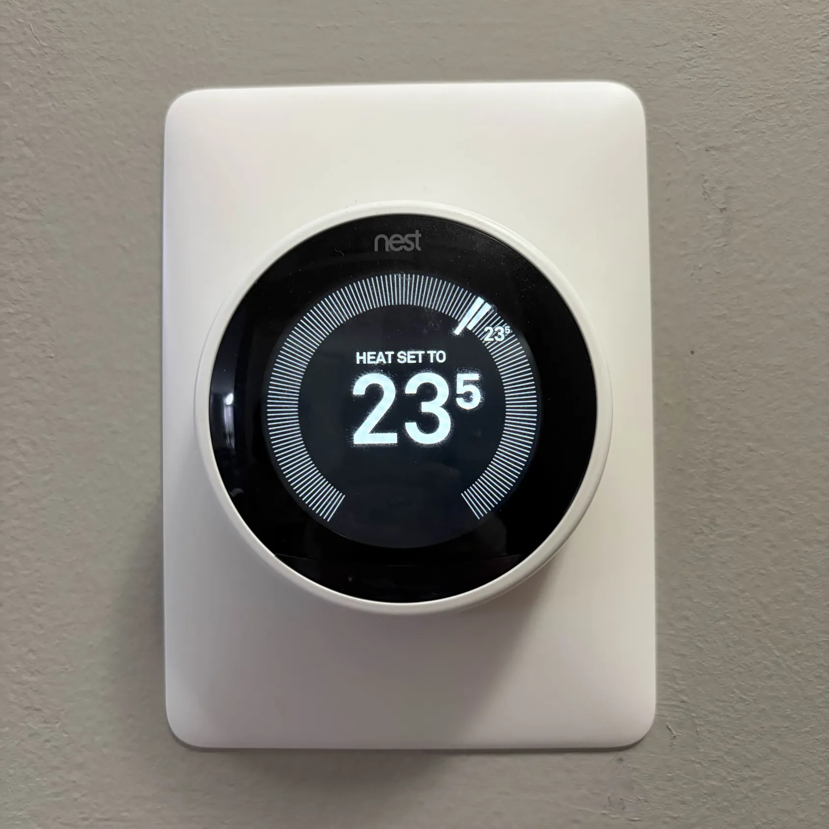 Adjusting the settings of a thermostat.
