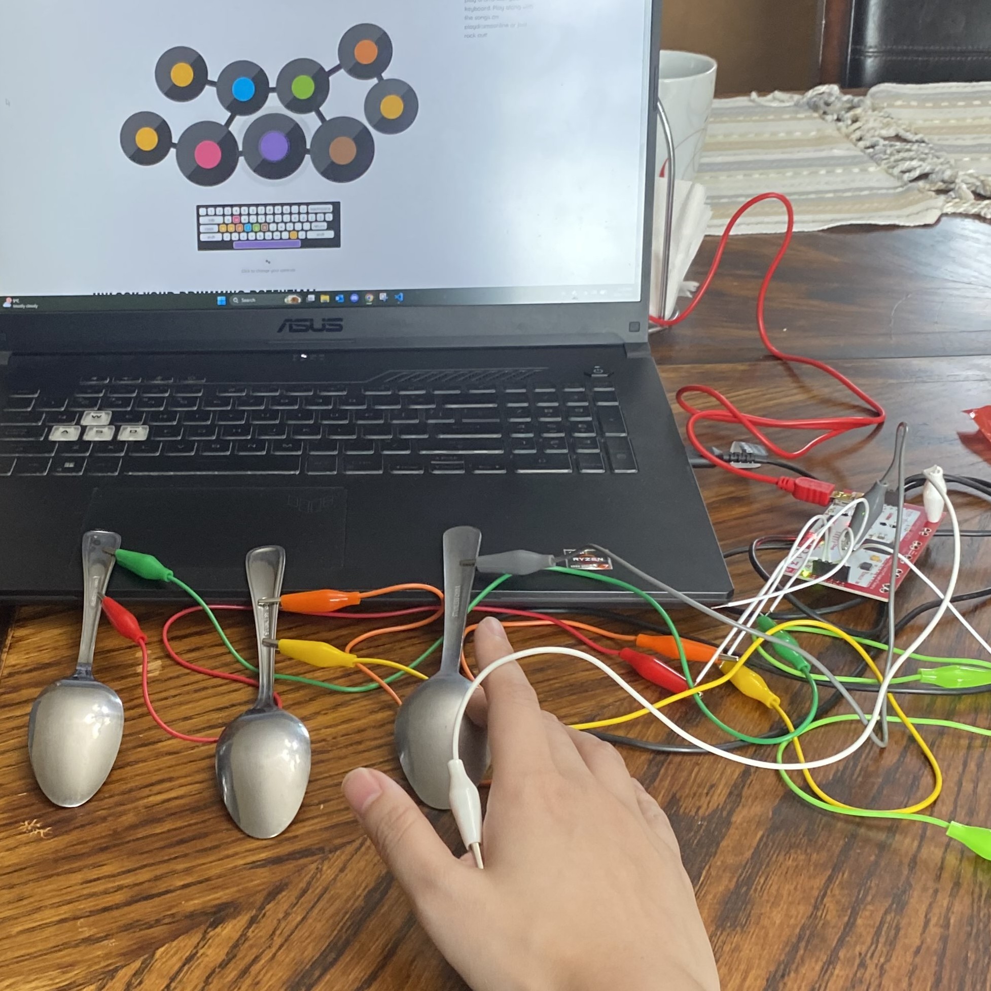 Using spoons as inputs with the online drum kit.