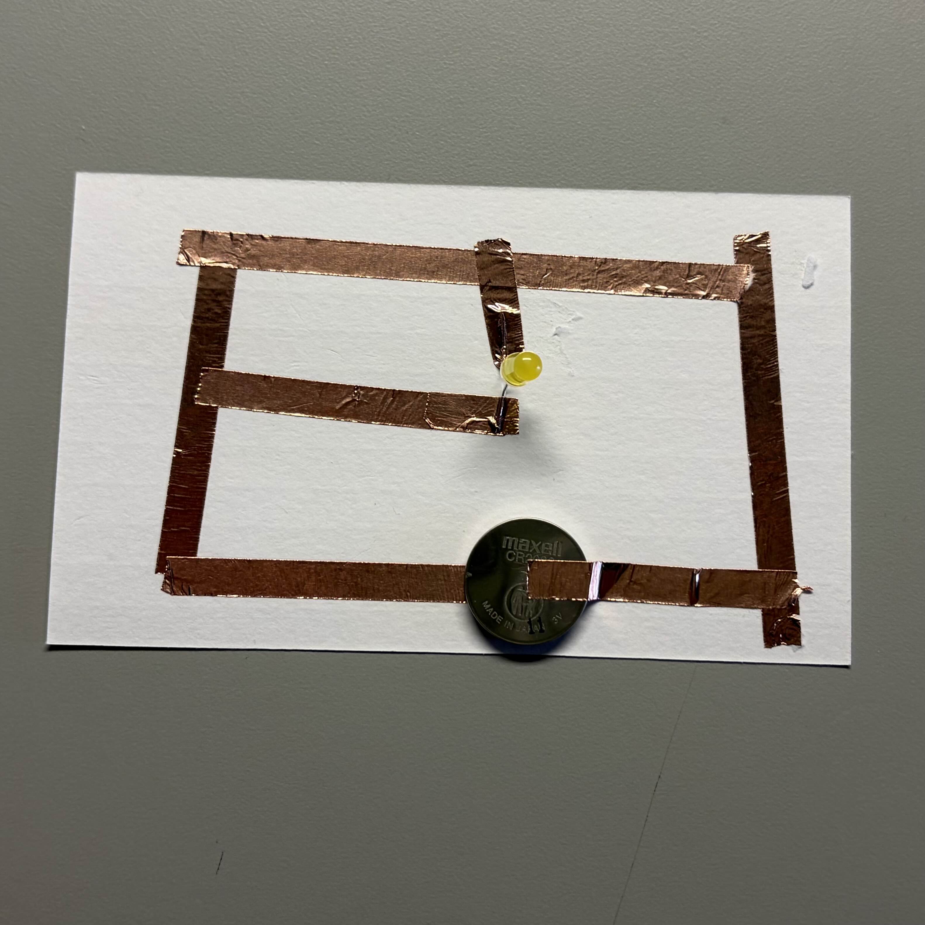 pExperimenting with this circuit pattern. It turns out that having tape over ripped paper adds resistance.
                I also tried swapping the light and battery on its positive/negative side to see if electricity can run through