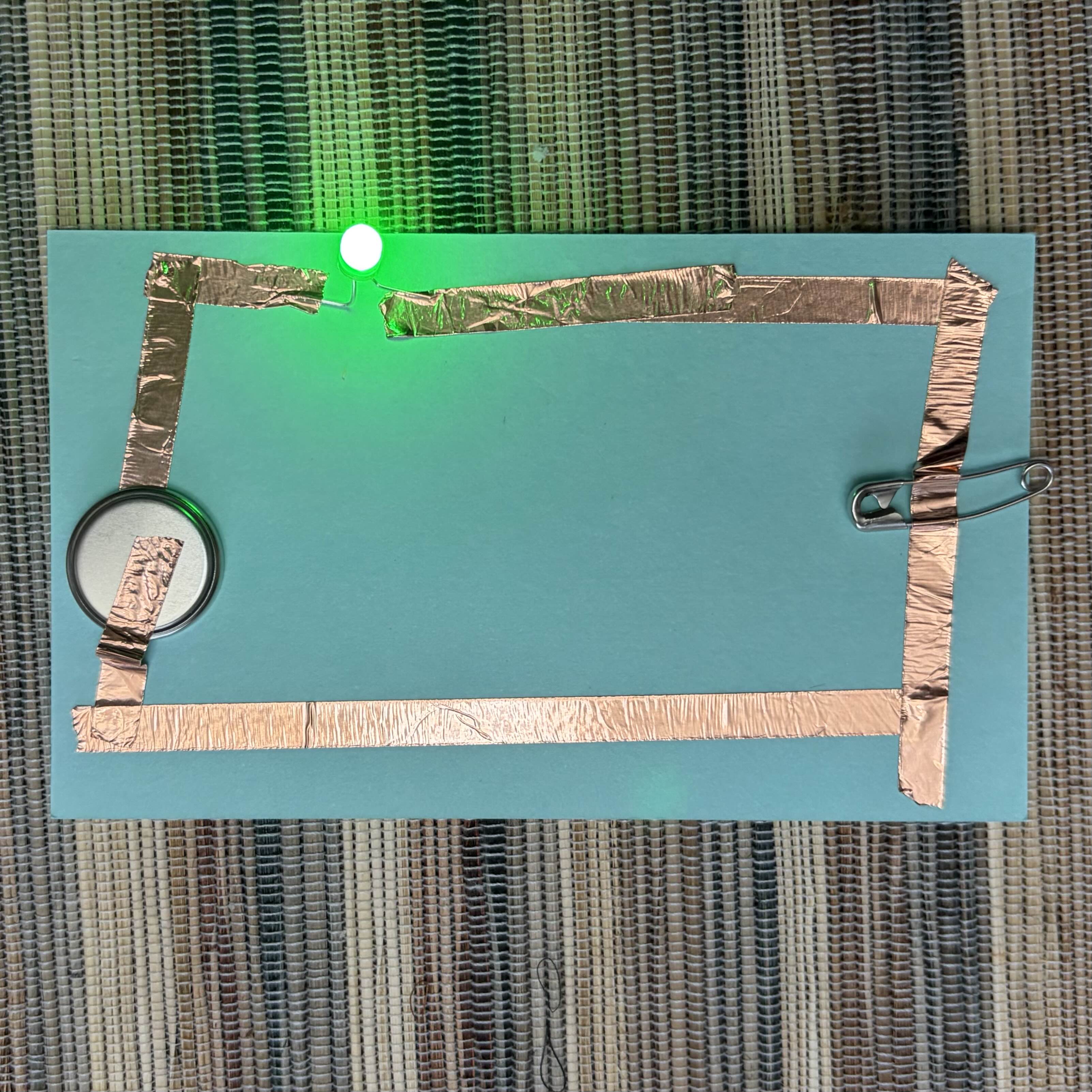 Having an extra item UNDER the circuit to see if electricity can continue to run through