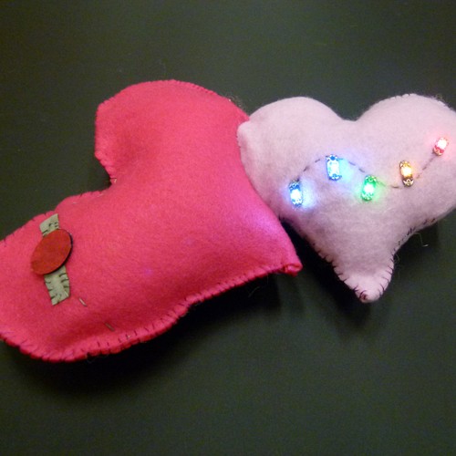 An idea of a non-wearable circuit. The plushie would light up by tapping the red dot on the
                big heart. <br> Original image source: https://www.elizabethwoyke.com/open-source-plushbot-project-makes-it-easy-to-create-interactive-diy-valentines/