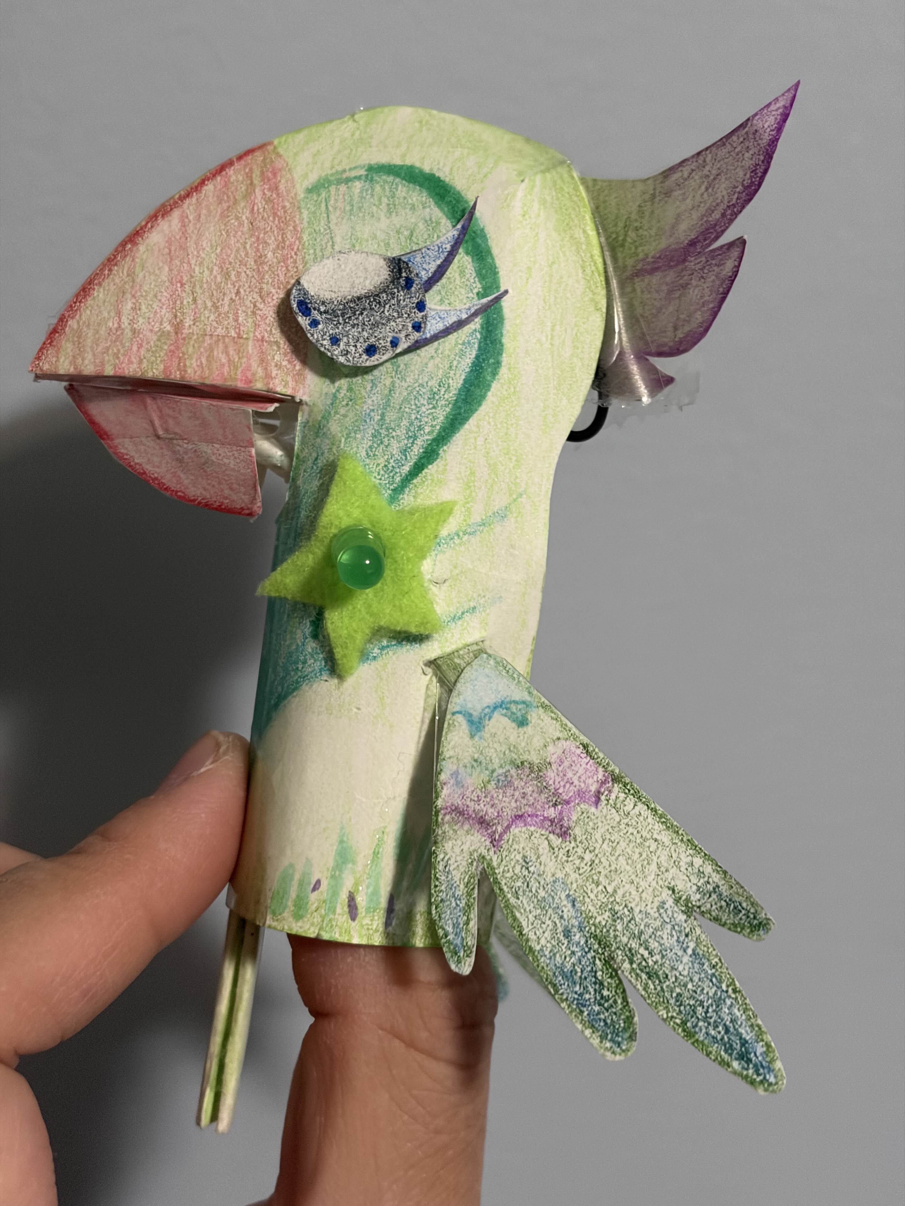 Bird puppet while the light is off.