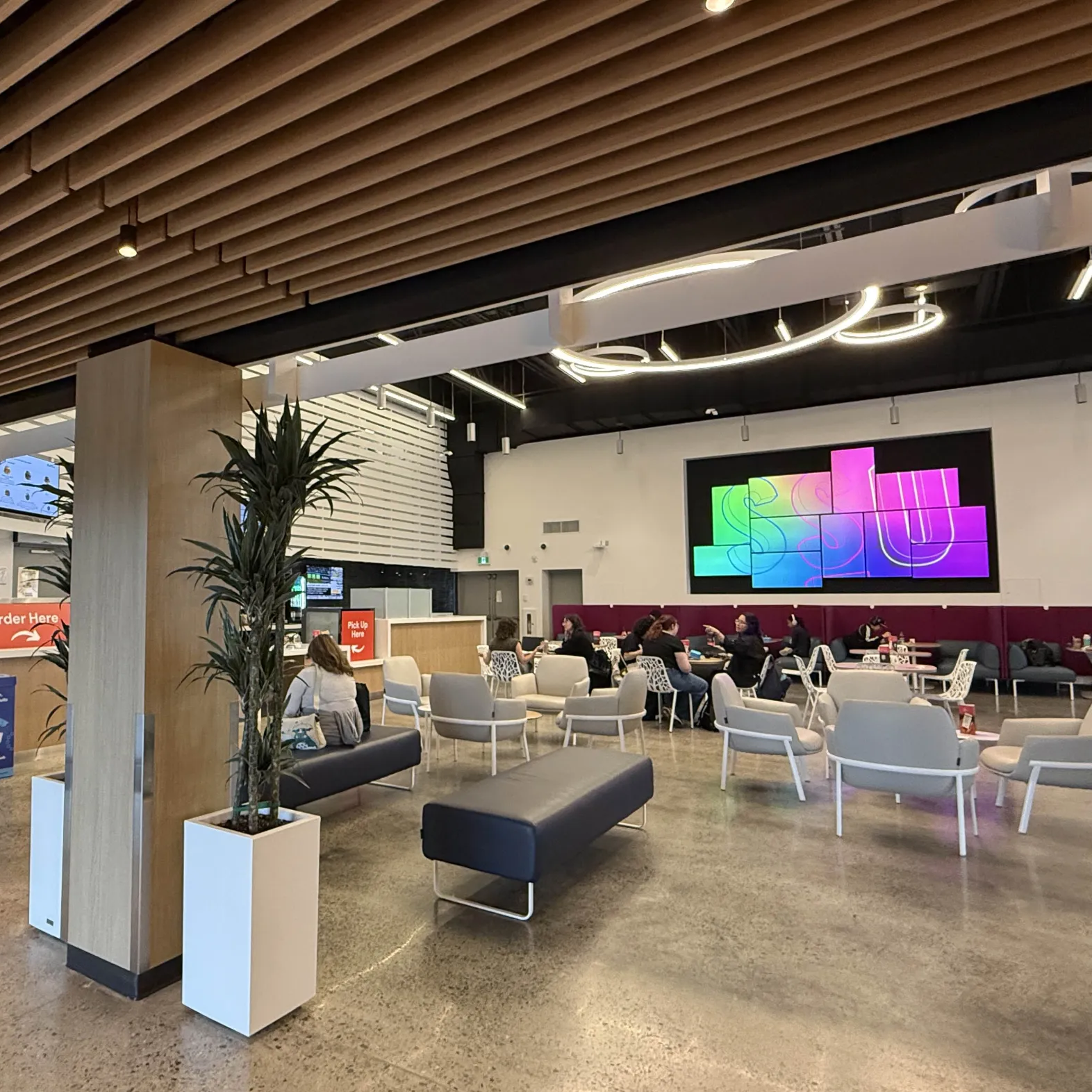 The Marquee.<br> Its modern vibe emits a cozy and homey feel with its warm colors and furniture. The area is
                large and spacious where students can order food at the bar, eat at the tables, study, 
                or hang out with friends.